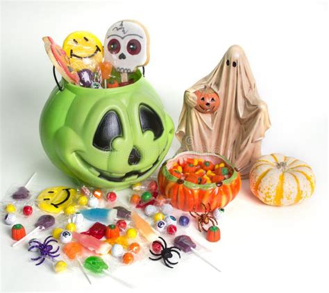 Halloween Pumpkin With Trick Or Treat Candy Sweets On A White