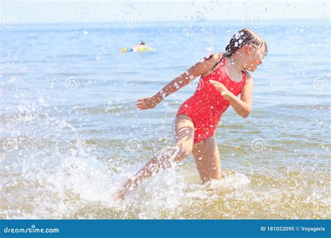 Little Girl Kid Splashing In Sea Ocean Water Fun Stock Image Image