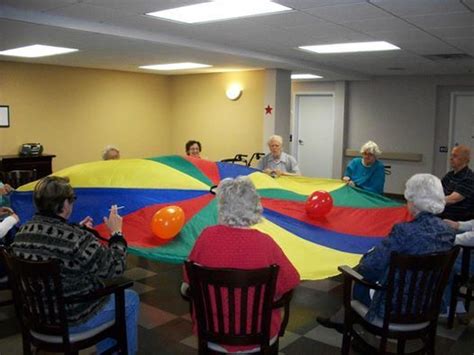 How do you keep the elderly entertained? Parachute games using balloons | Elderly activities ...