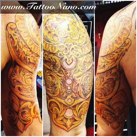 Armor tattoos unique armor tattoo on chest. Gold armour shoulder tattoo | Armor tattoo, Shoulder ...