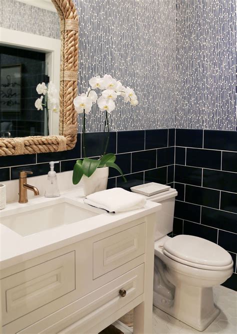 American standard bathroom centerset faucet. A braided rope mirror adds a coastal element to this ...