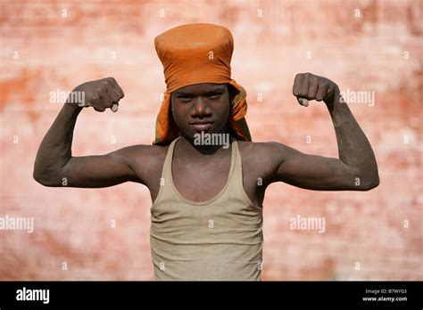 Indian Boy Flexing His Biceps Stock Photo Alamy
