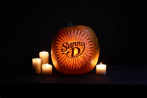 The Precise Art Of Carving Logos Into Pumpkins