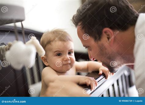 Father Putting Baby To Sleep At The Crib Stock Image Image Of