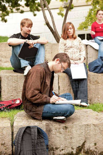 Students Studying Together Outdoors Stock Photo Dissolve