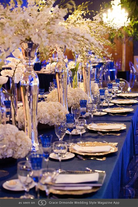 Royal Blue Tables With Pops Of Gold And Silver Featuring Phalaenopsis