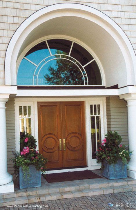 Custom Double Entry Door With Arched Transom Window Above Entrance