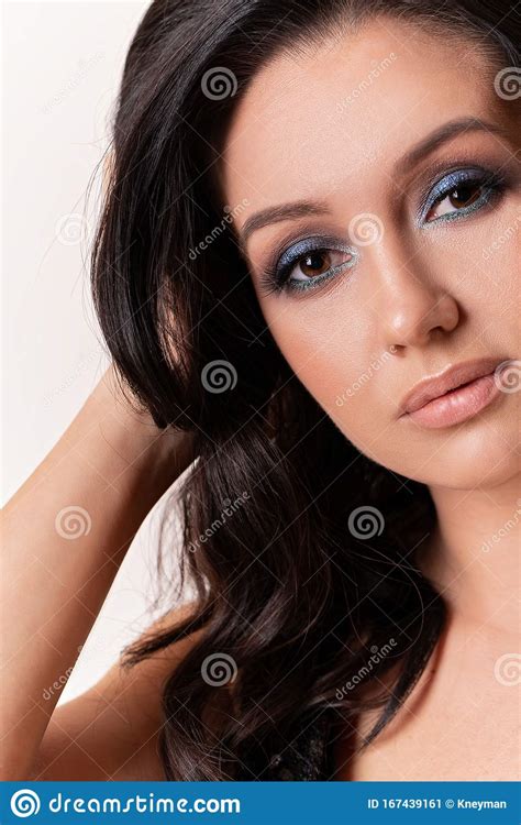 Close Up Portrait Of Beautiful Woman With Colored Blue Smokey Eyes Evening Festive Make Up