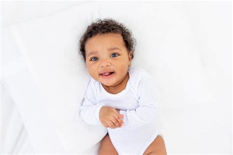 Premium Photo Smiling Little African American Baby In A Crib Portrait