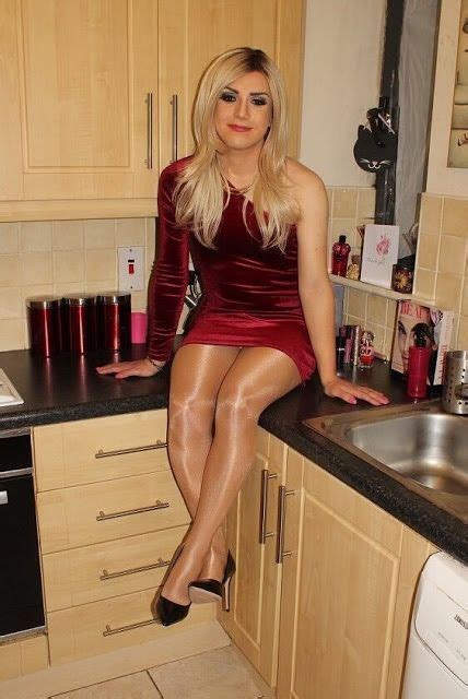 she looks so happy and sexy wearing her short red dress shiny