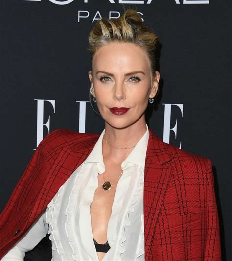 A Celebration Of Charlize Therons Ever Changing Hairstyles And Red