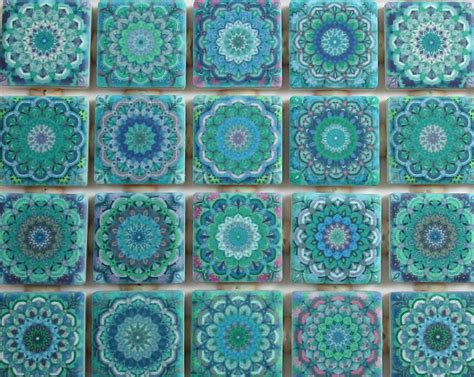 Many Blue And Green Tiles Are Arranged In The Shape Of An Intricate