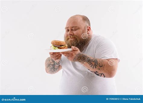 Cheerful Thick Guy Enjoying Unhealthy Hamburger Stock Photo Image Of