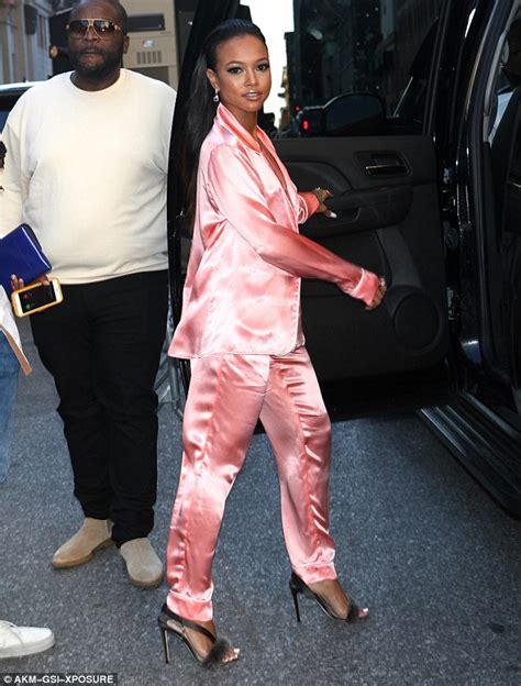 Karrueche Tran Teases Her Ample Assets In Plunging Pink Satin Pyjamas