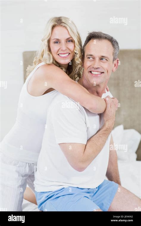 Cute Couple Cuddling In Bed Stock Photo Alamy