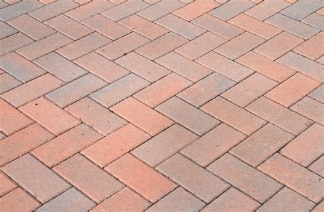 Starting in the center section, lay pavers in the desired pattern, working off your string line. When to Replace Your Brick Paver Driveway