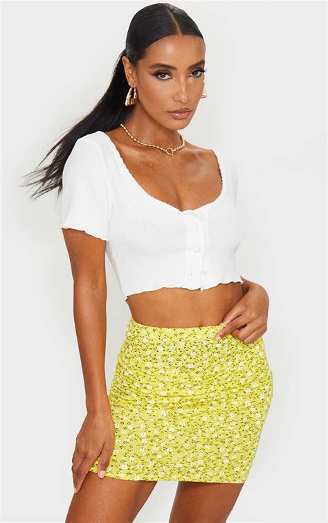 Yellow Ditsy Floral Print Mini Skirt Skirts Prettylittlething Aus