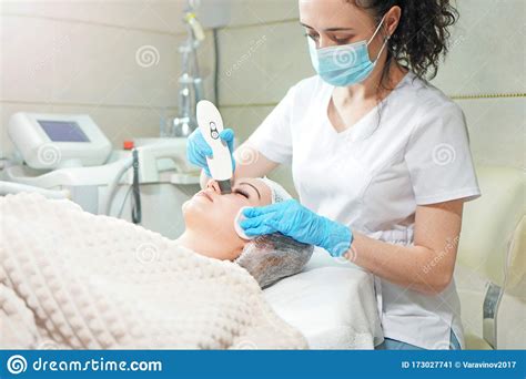 Peeling Treatment Cosmetologist Doing Ultrasonic Face Peel For The
