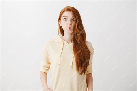 Free Photo Funny Redhead Girl Sucking Lips Like Fish Grimacing