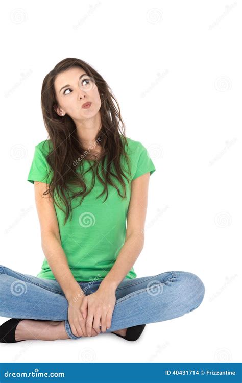 Isolated Young Pensive Woman Sitting With Crossed Legs Stock Photo