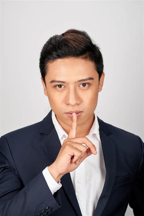 Portrait Of Asian Handsome Businessman Dressed In Suit Showing Silence