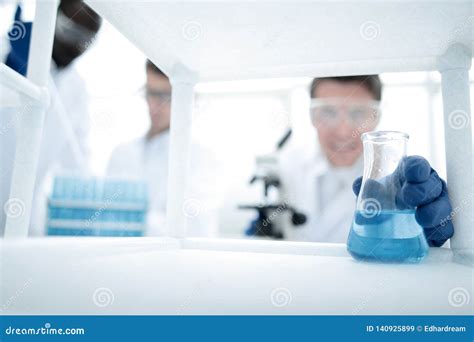 Group Of Microbiologists In The Workplace In The Laboratory Stock Image