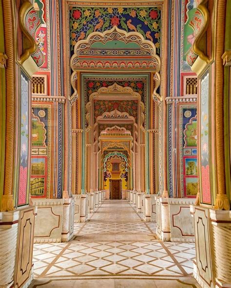 An Ornate Hallway With Colorful Painted Walls And Columns On Either