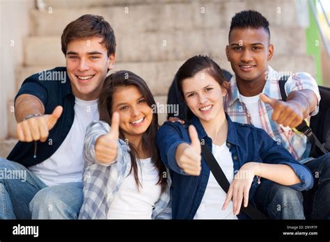 Group Smiling High School Students Giving Thumbs Up Stock Photo Alamy