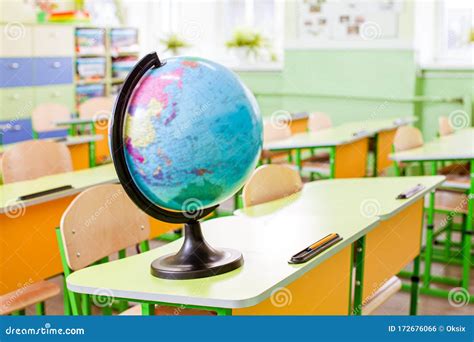 Earth Globe On The Yellow Desk At Classroom Stock Photo Image Of