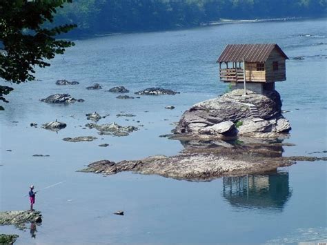 Tiny Home On Drina River In Serbia Sits On Rock Surrounded By Water