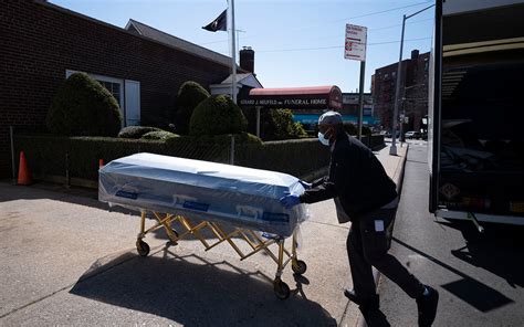 Closed Caskets Empty Chairs At Funeral Home In New York Virus