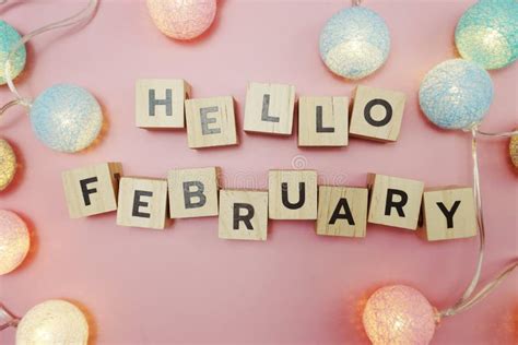 Hello February Alphabet Letters With Pink Flower Decoration On Purple