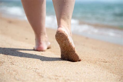 Closeup Of Bare Feet On The Beach Walking On The Sand At The Water`s Edge Stock Image Image