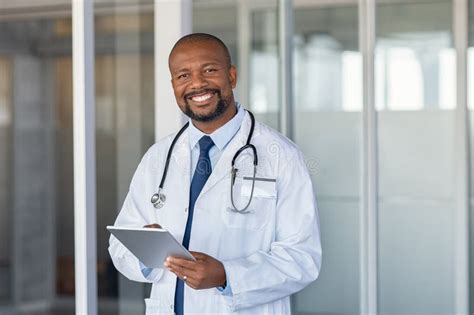 Portrait Of Happy African Doctor At Private Clinic Stock Image Image