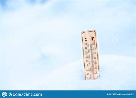 Winter Time Thermometer On Snow Shows Low Temperatures Stock Image