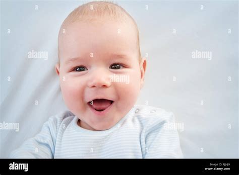 Three Month Old Baby Lying In Bed Stock Photo Alamy