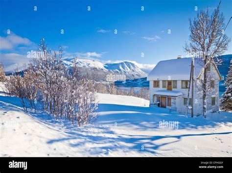 Snow Covered House In Norwegian Village Of Laukslett Troms North