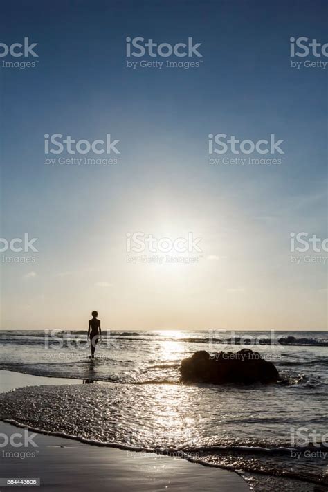 Skinny Girl Standing On Idyllic Deserted Beach In Fernando De Noronha