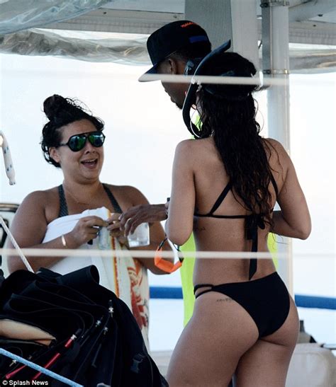 rihanna shows off her flawless figure in a halter neck bikini during a snorkelling trip with