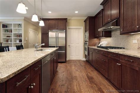 An easy way to coordinate cabinetry and granite countertops is to pair dark cabinetry with granite colors that are in a lighter shade of the same color, or have veining of the same color. Oak Floors with Dark Walnut Cabinets | Something for Mom ...