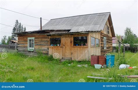 A Private House In The Northern Village Of Yakutia Made Of Pine Timber