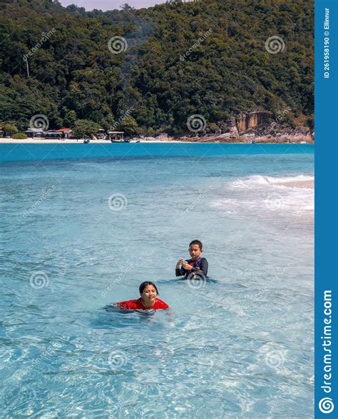 Children Swimming At The Beach Together In A Sunny Day Stock Photo