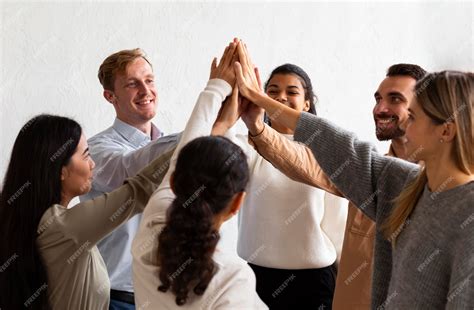 Free Photo Happy People High Fiving Each Other At A Group Therapy Session