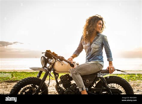 Beautiful Female Biker Driving A Cafe Racer Motorbike Pretty Girl