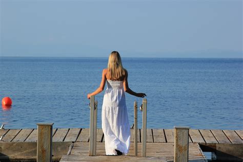 Free Images Beach Sea Coast Ocean Girl Sun Vacation Sitting Blue Blonde Dress
