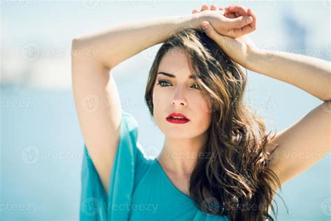 Woman With Blue Eyes Wearing Blue Dress In The Beach 5355021 Stock