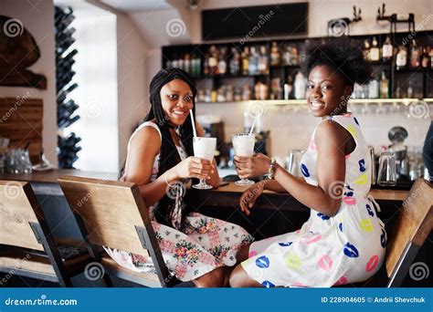 two black african girlfriends at summer dresses posed at cafe stock image image of girls lady