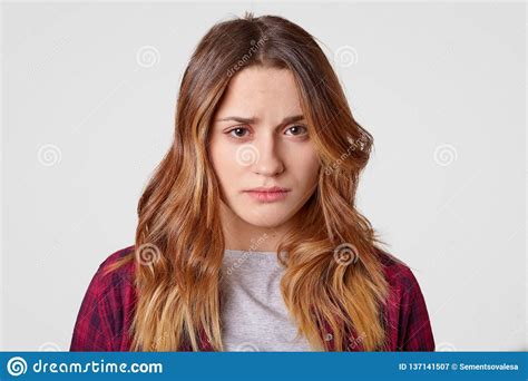 Sad Young Woman With Sorrowful Expression Feels Frustrated Has Long