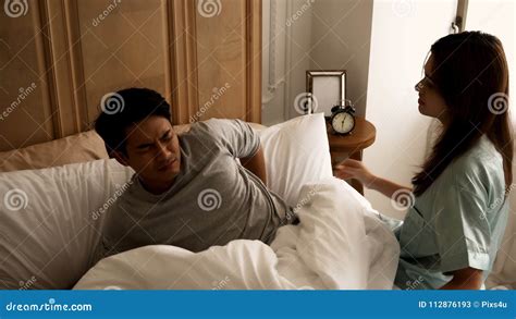Young Wife Woke Her Husband To Wake Up When Late Royalty Free Stock