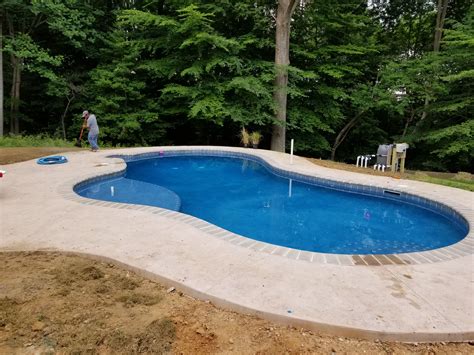 Concrete Swimming Pool With Brick Coping Stamped Concrete And Tanning